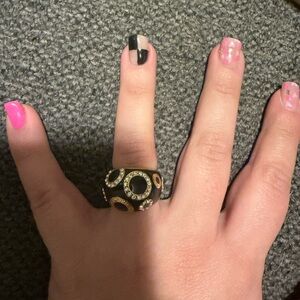 Elegant Black and Gold Ring Coach brand